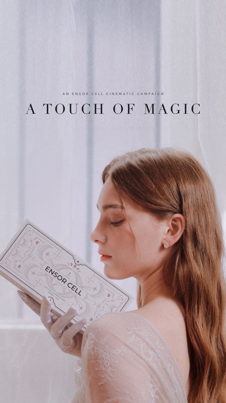 A TOUCH OF MAGIC campaign film poster: a model in white lace holding the ENSOR CELL box to her face in a bright white room